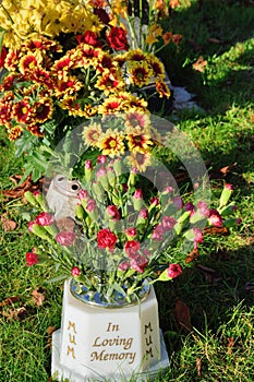 Memoriam flowers standing up in vase photo