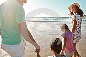 These memories will last a lifetime. a family enjoying some quality time together at the beach.