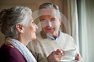 When the memories are worth the wrinkles. a senior couple enjoying soma alone time at home.