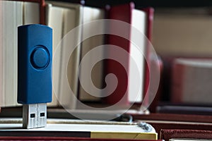 Stack books on wooden background. USB