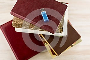 Memorization of knowledge: books and organizer are on the table