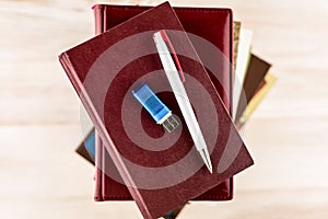 Memorization of knowledge: books and organizer are on the table