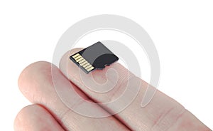 Memory card on finger micro SD flash on white background