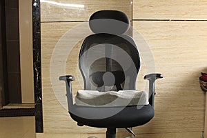 Memory foam sciatica cushion in black office chair at home