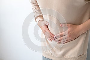 Men with abdominal pain standing, holding the body and hands Photos, concepts of health and medical care