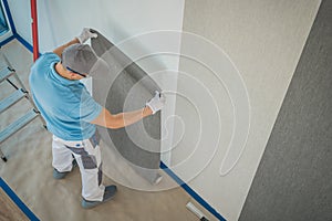 Men Applying Brand New Modern Wallpaper