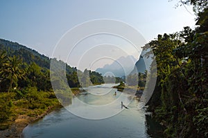 Men on bamboo rafts