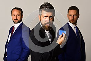 Men with beard and determined faces advertise company and partnership