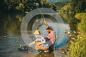 Men bearded fishermen. Happiest man. Fishman crocheted spin into the river waiting big fish. Young man fishing. Just do