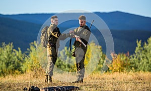 Men bearded hunters with rifle nature background. Experience and practice lends success hunting. How turn hunting into