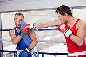 Men boxing.