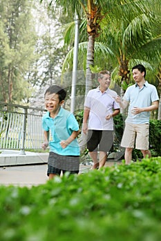 Men and boy taking a stroll down the promenade. Conceptual image