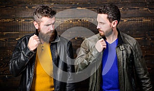 Men brutal bearded hipster posing in fashionable black leather jackets. Handsome stylish and cool. Feel confident in