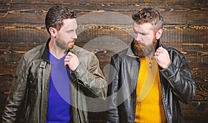 Men brutal bearded hipster posing in fashionable black leather jackets. Handsome stylish and cool. Feel confident in