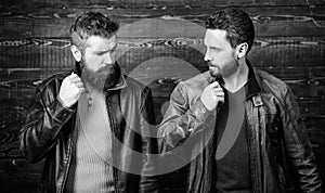 Men brutal bearded hipster posing in fashionable black leather jackets. Handsome stylish and cool. Feel confident in