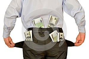 Men businessman showing empty pockets hiding behind wads of money