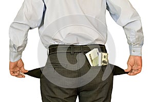 Men businessman showing empty pockets hiding behind wads of money photo