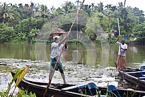 Men in canoe in Backwaters