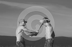 Men in caps fighting with baseball bat