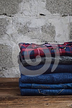 Men casual outfit. Men& x27;s shoes, clothing and accessories on wooden background - sweater, jeans. Top view. Flat lay