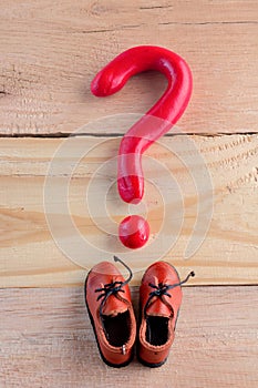 Men casual shoes and a question mark