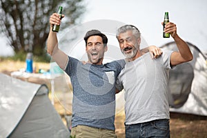 men celebrating wth beer catch fish