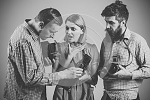 Men in checkered clothes, retro style. Vintage photography concept. Company of busy photographers with old cameras