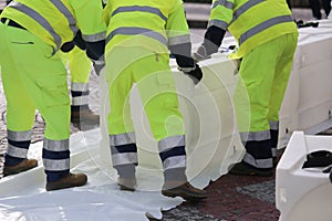 Men of civil protection with high visibility clothing during an photo