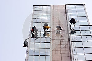 Men cleaning windows on a corporate bouilding