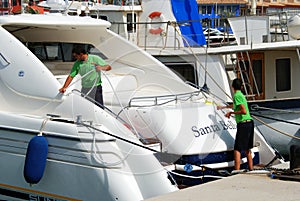 Men cleaning a yacht, Sotogrande.
