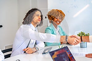 Men closing a deal during a meeting in a coworking