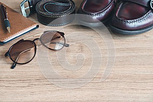 Men clothing and accessories on wooden table