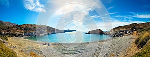 Men on deserted beach near ancient Greek city Knidos. Turkey. Panorama.