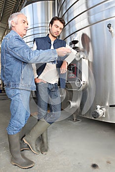 Men discussing the merits of wine