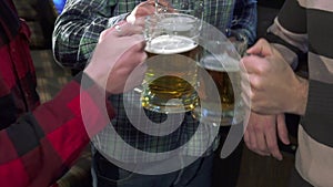 Men drink lager near the bar counter