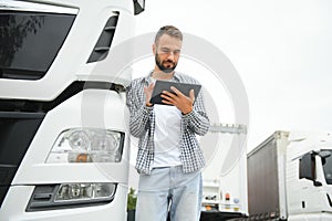 Men driver near lorry truck. Man owner truck driver near truck. Man trucker trucking owner. Transportation industry