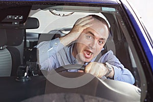 Men driving. emotion. Screaming, scared