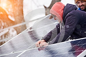 Men are engaged in the installation of solar cells