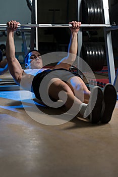 Men Exercising Back On Horizontal Barbell Pull Up