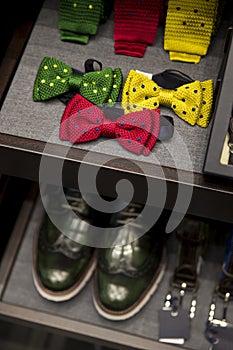 Men fashion accessories in a shop. Men belt, shoes and tie.