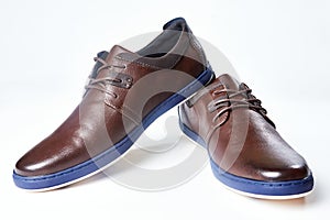 Men fashion brown shoe leather over white background. Pair casual stylish footwear