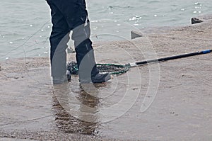 Men fishing for small spring coho salmon