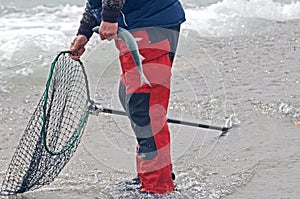 Men fishing for small spring coho salmon