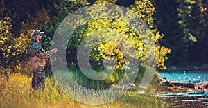 Men Fly Fishing in a River