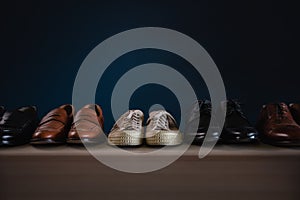 Men Footwear Fashion. Variety of MaleÃ¢â¬â¢s Shoes on Shelf in House photo