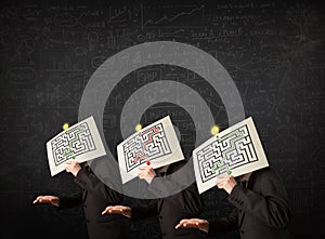 Men in formal gesturing with labyrinth