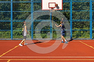 Men friends basketball players playing games outdoor enjoying great match.