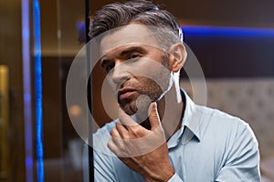 Men Grooming. Handsome Man With Beard Touching Face. Skin Care