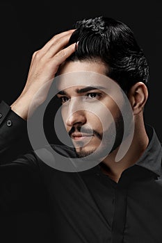 Men Hair Beauty. Handsome Male Model Touching Healthy Hair