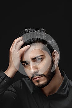Men Hair Care. Man With Beard, Beauty Face Touching Black Hair